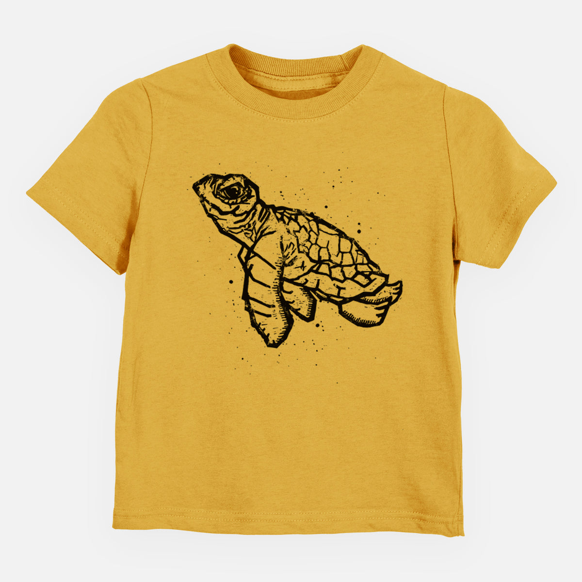 Honeycomb yellow toddler t-shirt laid flat, printed with a black linocut-style illustration of a baby sea turtle with a patterned shell and ink splatters.