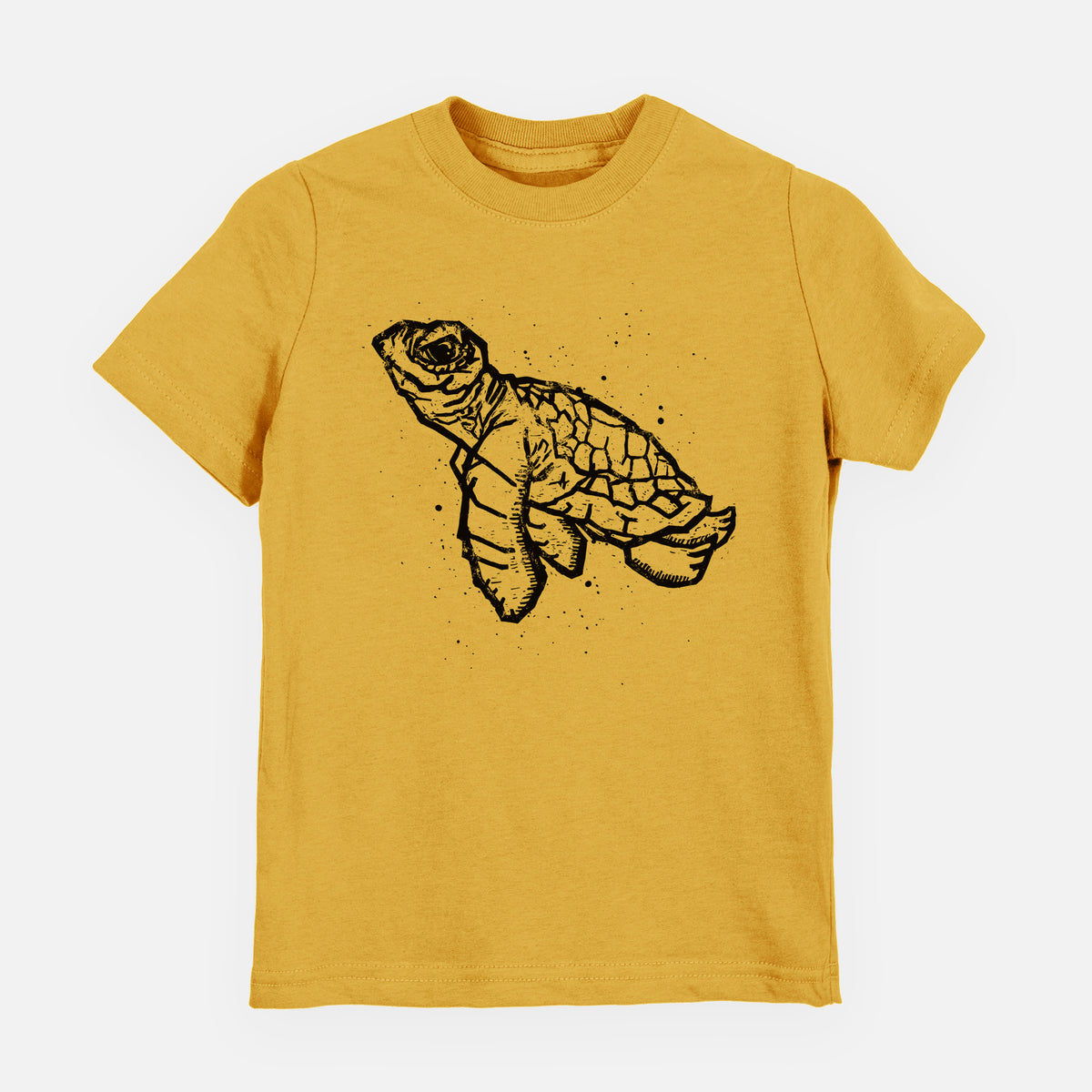 Honeycomb yellow youth t-shirt laid flat, printed with a black linocut-style illustration of a baby sea turtle with a patterned shell and ink splatters.