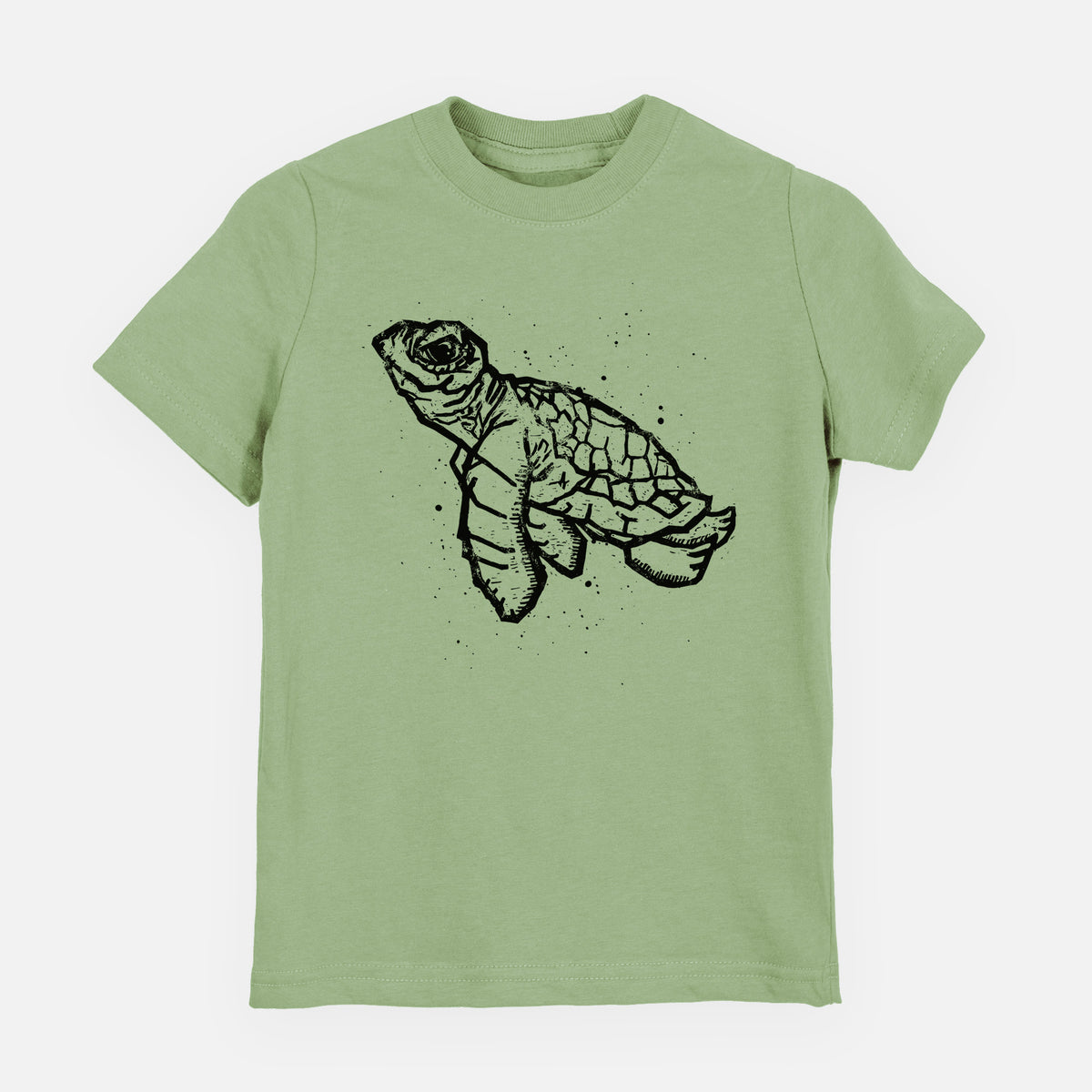 Sage green youth t-shirt laid flat, printed with a black linocut-style illustration of a baby sea turtle with a patterned shell and ink splatters.