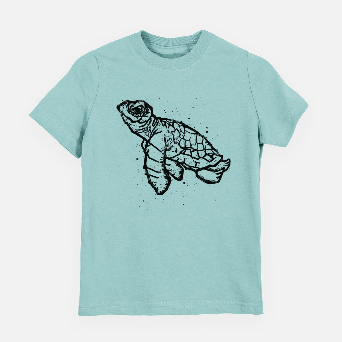 Saltwater youth t-shirt laid flat, printed with a black linocut-style illustration of a baby sea turtle with a patterned shell and ink splatters.