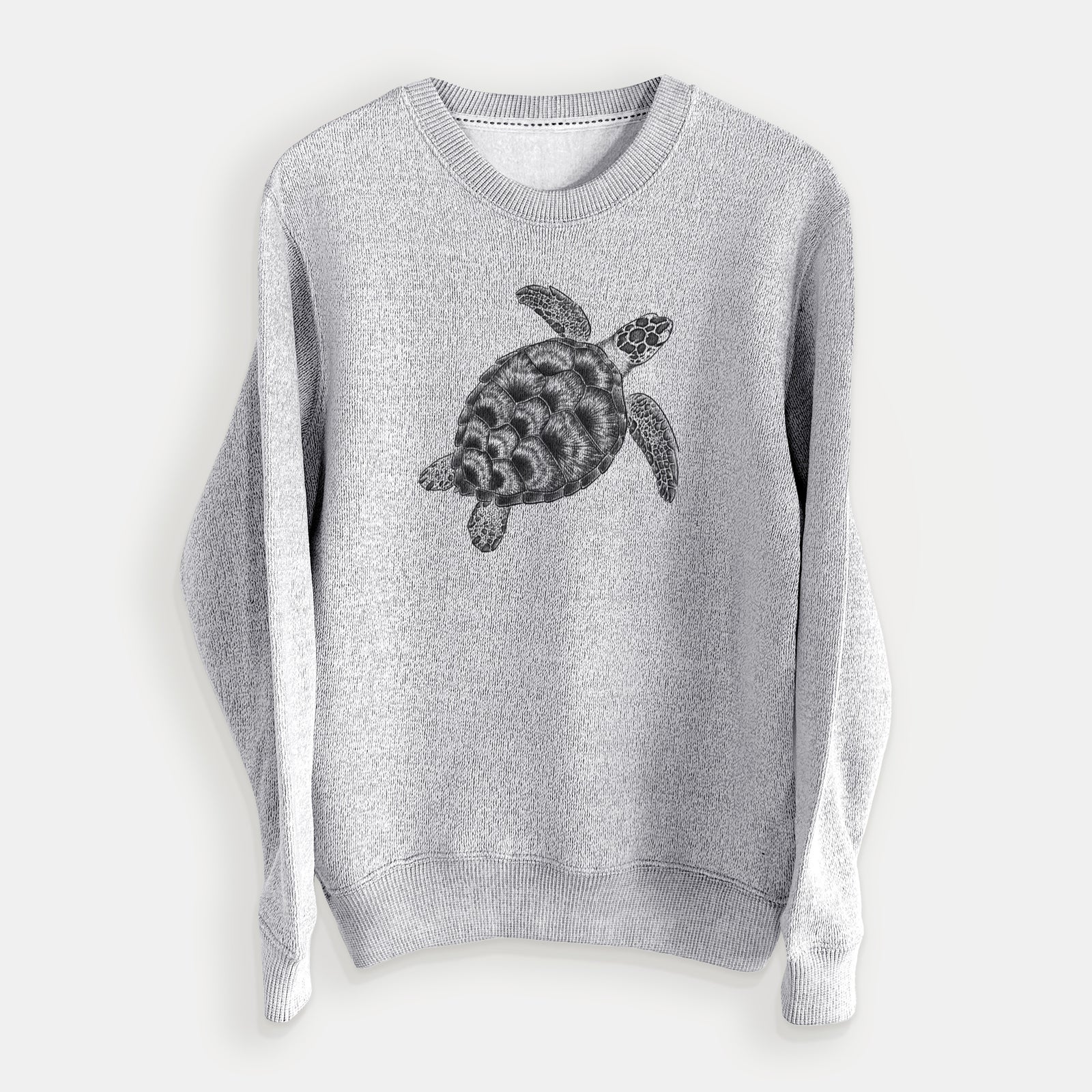 Salt and pepper knit sweatshirt laid flat, printed with a detailed black ink illustration of a loggerhead sea turtle swimming, seen from above.