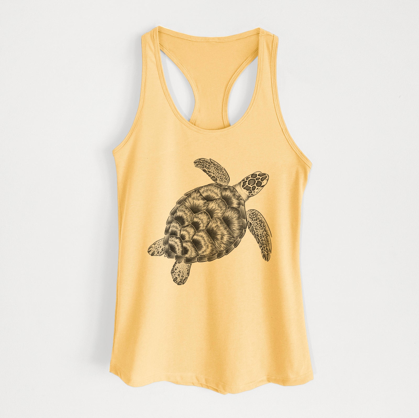 Banana cream women's racerback tank top laid flat, printed with a detailed black ink illustration of a loggerhead sea turtle swimming, seen from above.