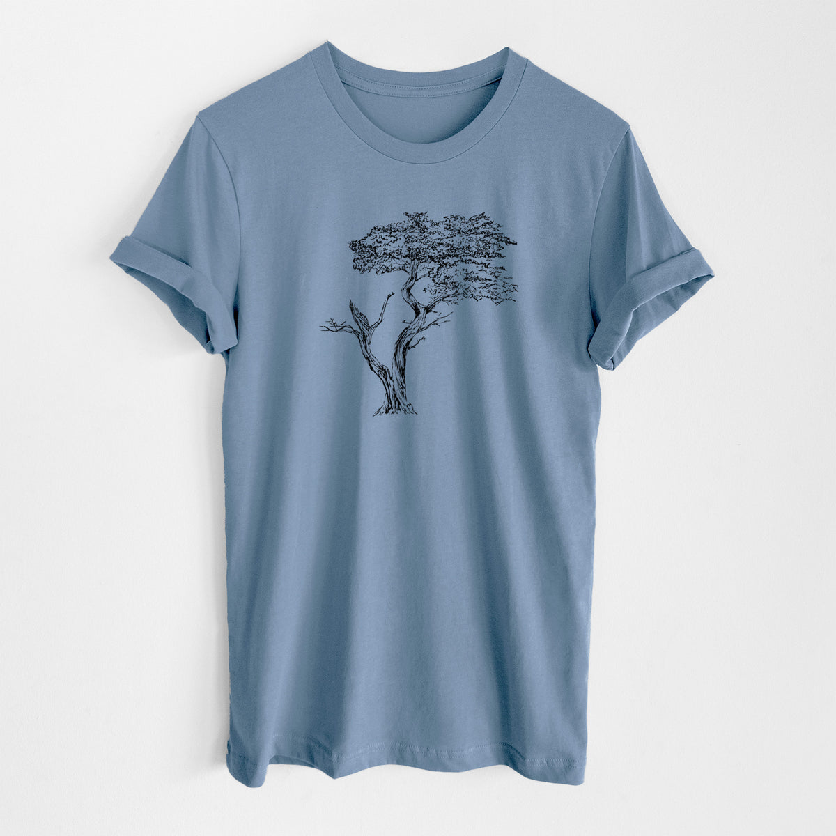 Steel blue lightweight cotton t-shirt laid flat, printed with a black ink illustration of the windswept Lone Cypress tree on a rocky outcrop.