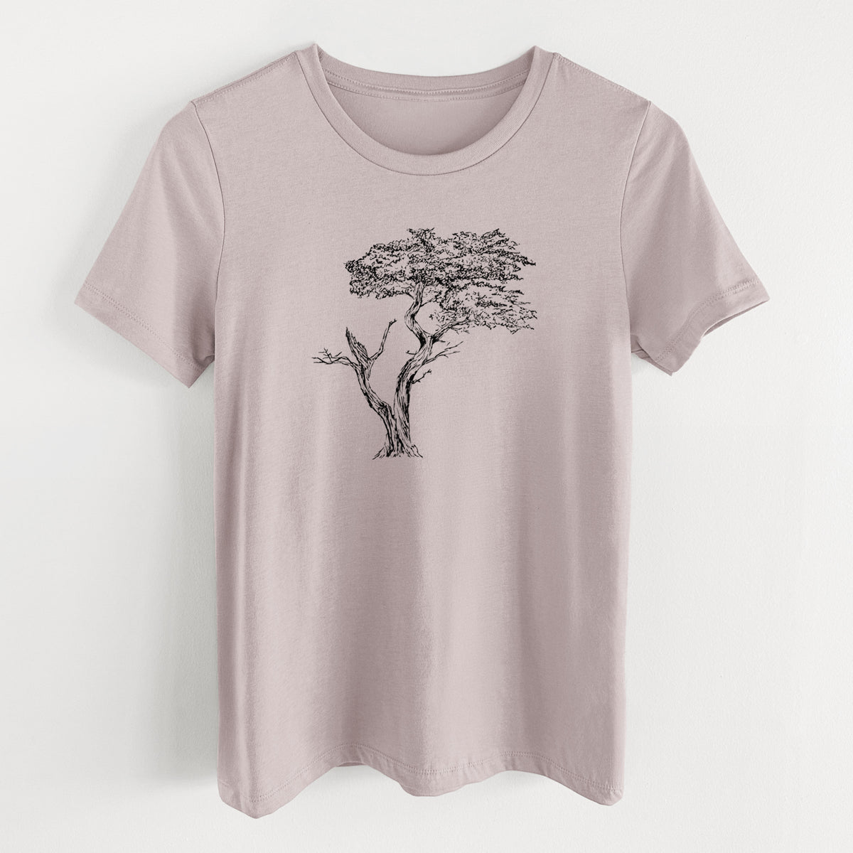 Pink gravel women's relaxed fit cotton t-shirt laid flat, printed with a black ink illustration of the windswept Lone Cypress tree on a rocky outcrop.