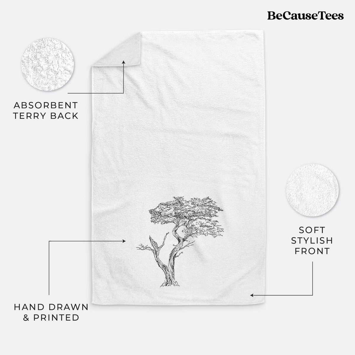 White hand towel printed with a black ink illustration of the windswept Lone Cypress tree on a rocky outcrop.