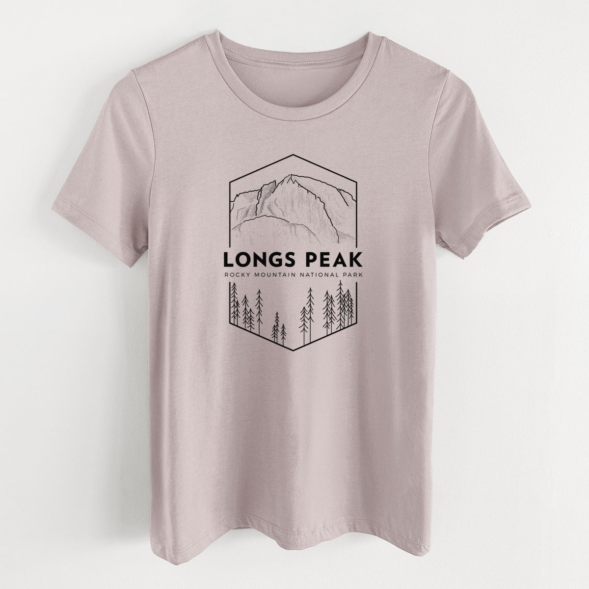 Pink gravel women's relaxed fit cotton t-shirt laid flat, printed with a black line art badge of Longs Peak above a pine forest, with the words Longs Peak, Rocky Mountain National Park.