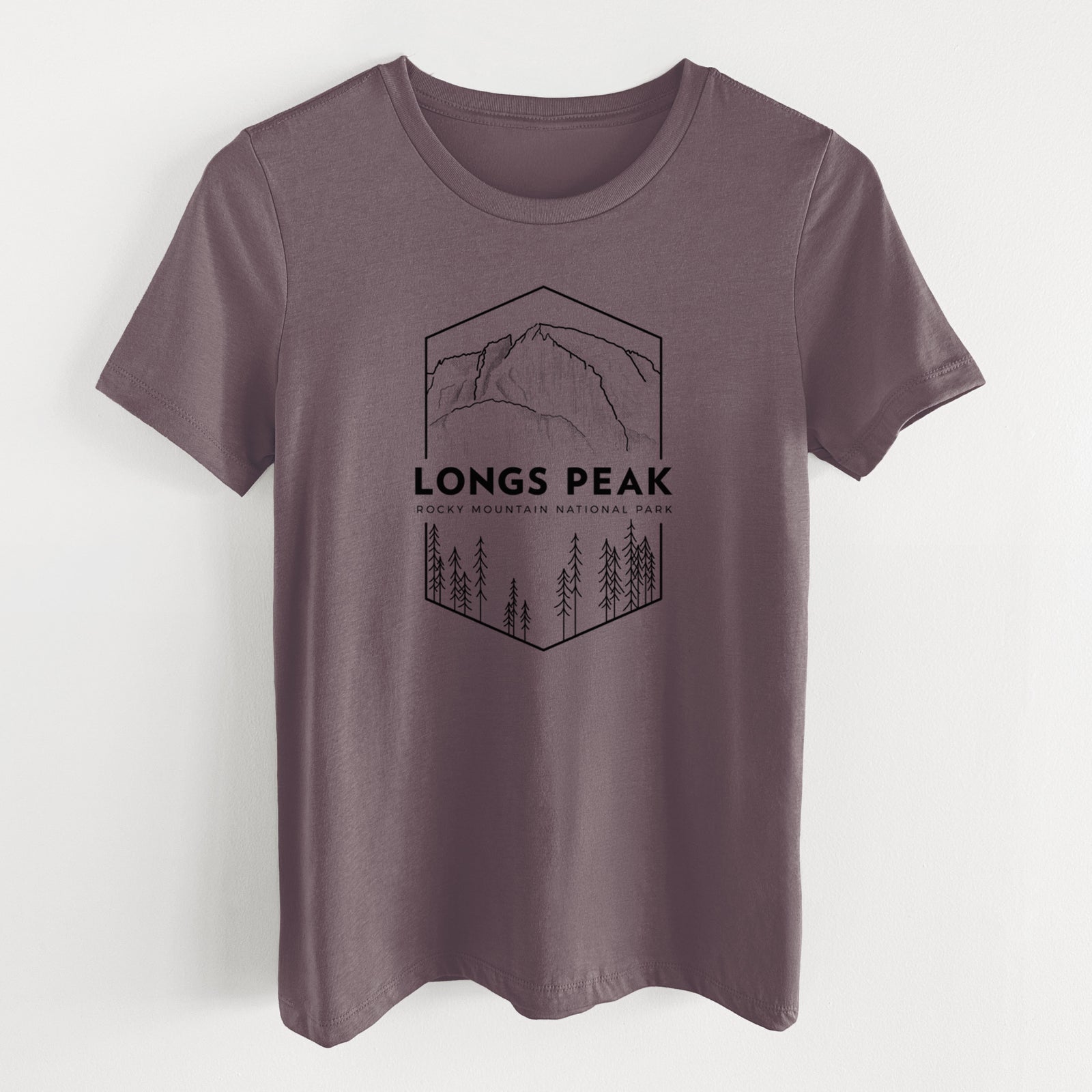 Purple storm women's relaxed fit cotton t-shirt laid flat, printed with a black line art badge of Longs Peak above a pine forest, with the words Longs Peak, Rocky Mountain National Park.