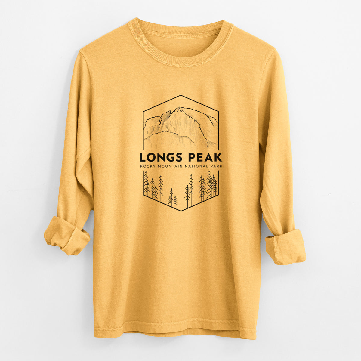 Golden wheat yellow Comfort Colors long sleeve shirt laid flat with the cuffs rolled, printed with a black line art badge of Longs Peak above a pine forest, with the words Longs Peak, Rocky Mountain National Park.