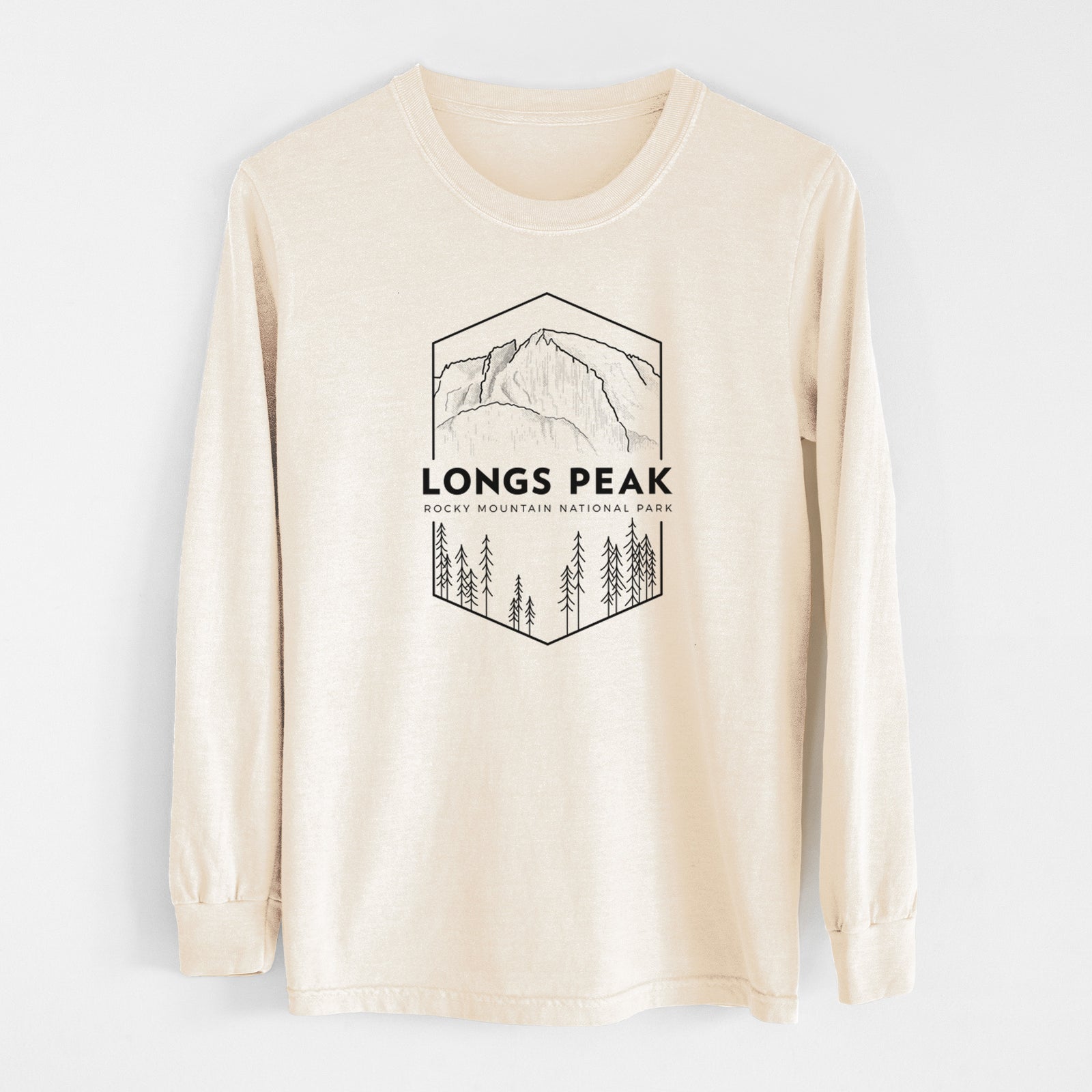 Ivory Comfort Colors long sleeve shirt laid flat, printed with a black line art badge of Longs Peak above a pine forest, with the words Longs Peak, Rocky Mountain National Park.