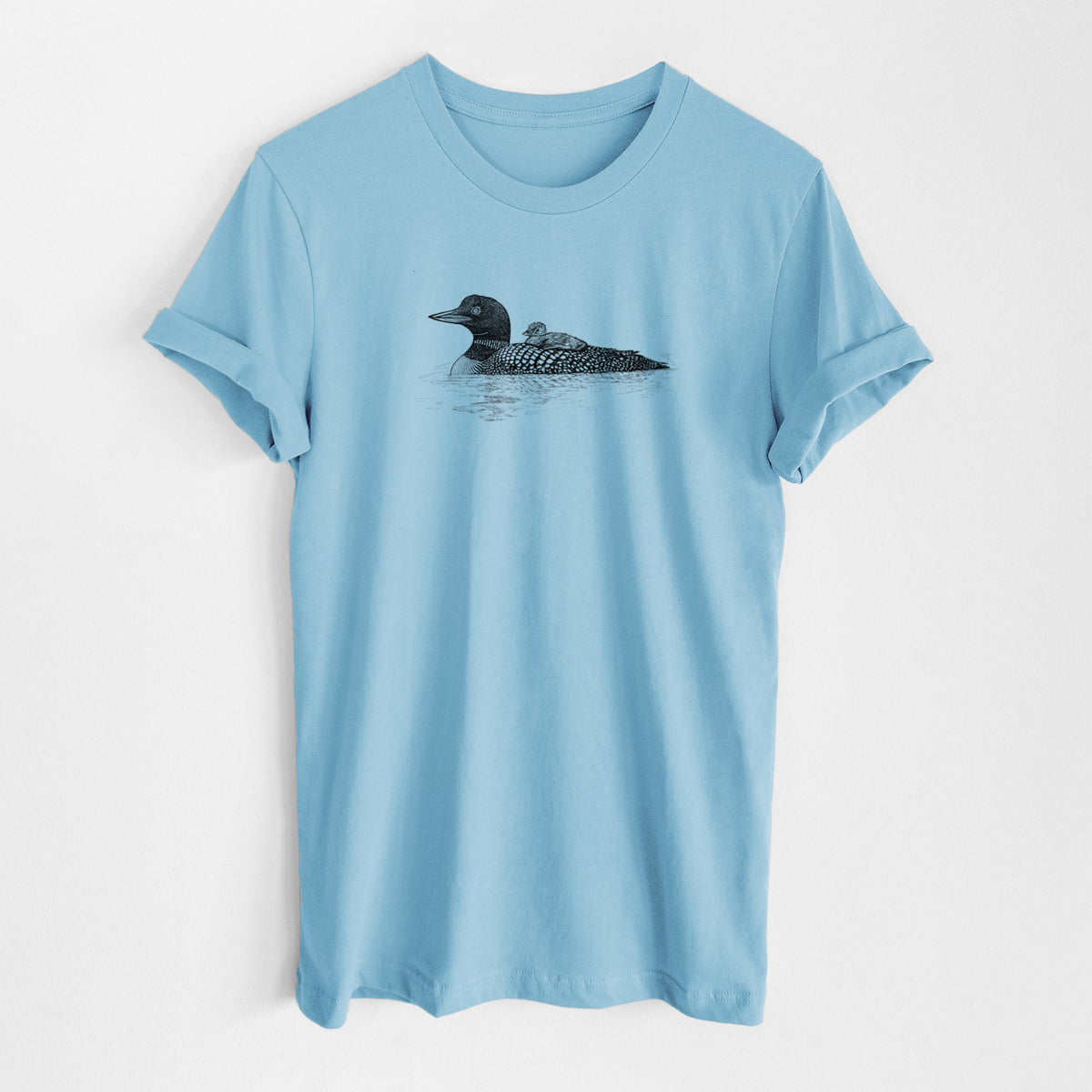 Ocean blue lightweight cotton t-shirt laid flat, printed with a black ink sketch of a common loon floating on water with a chick riding on its back.
