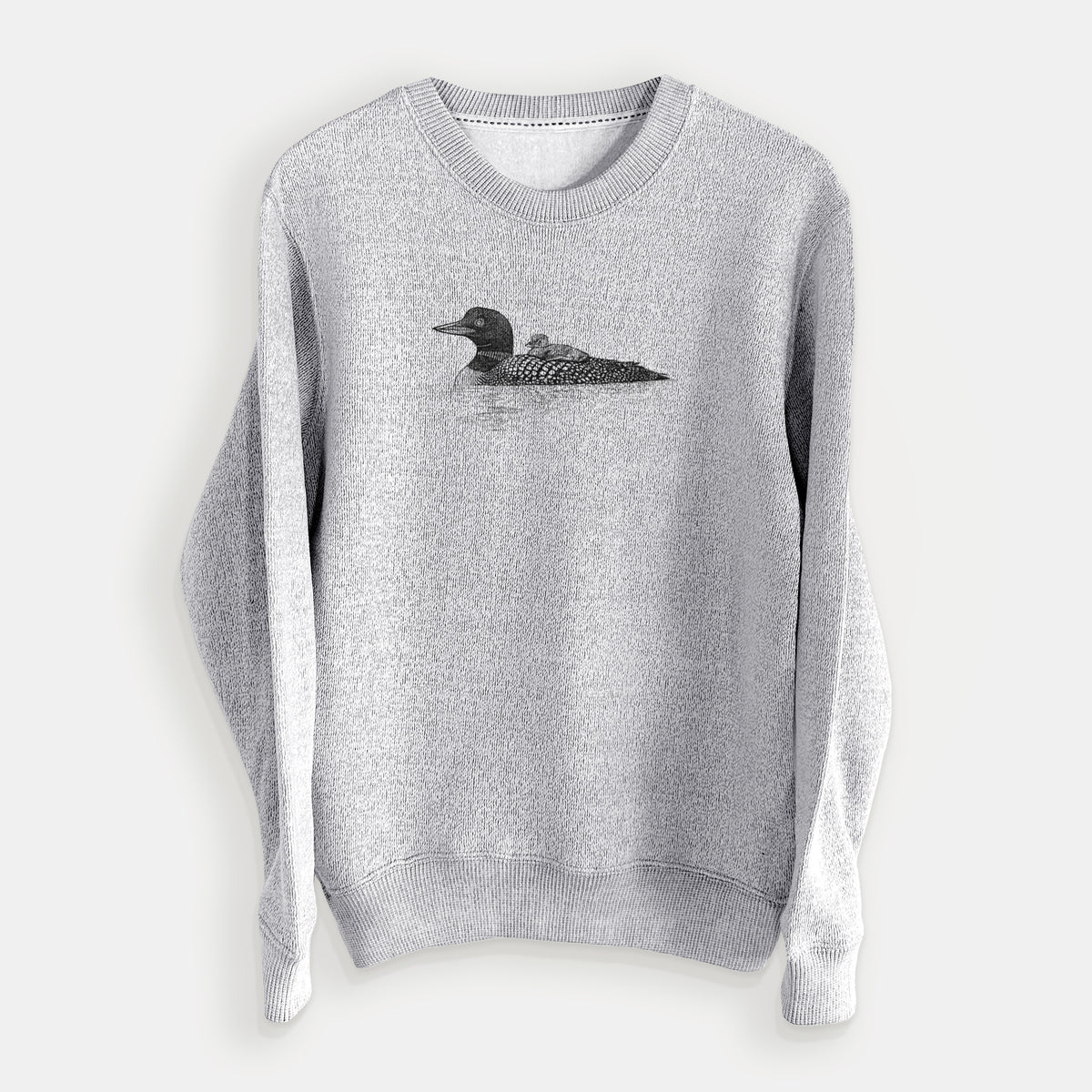 Salt and pepper knit sweatshirt laid flat, printed with a black ink sketch of a common loon floating on water with a chick riding on its back.