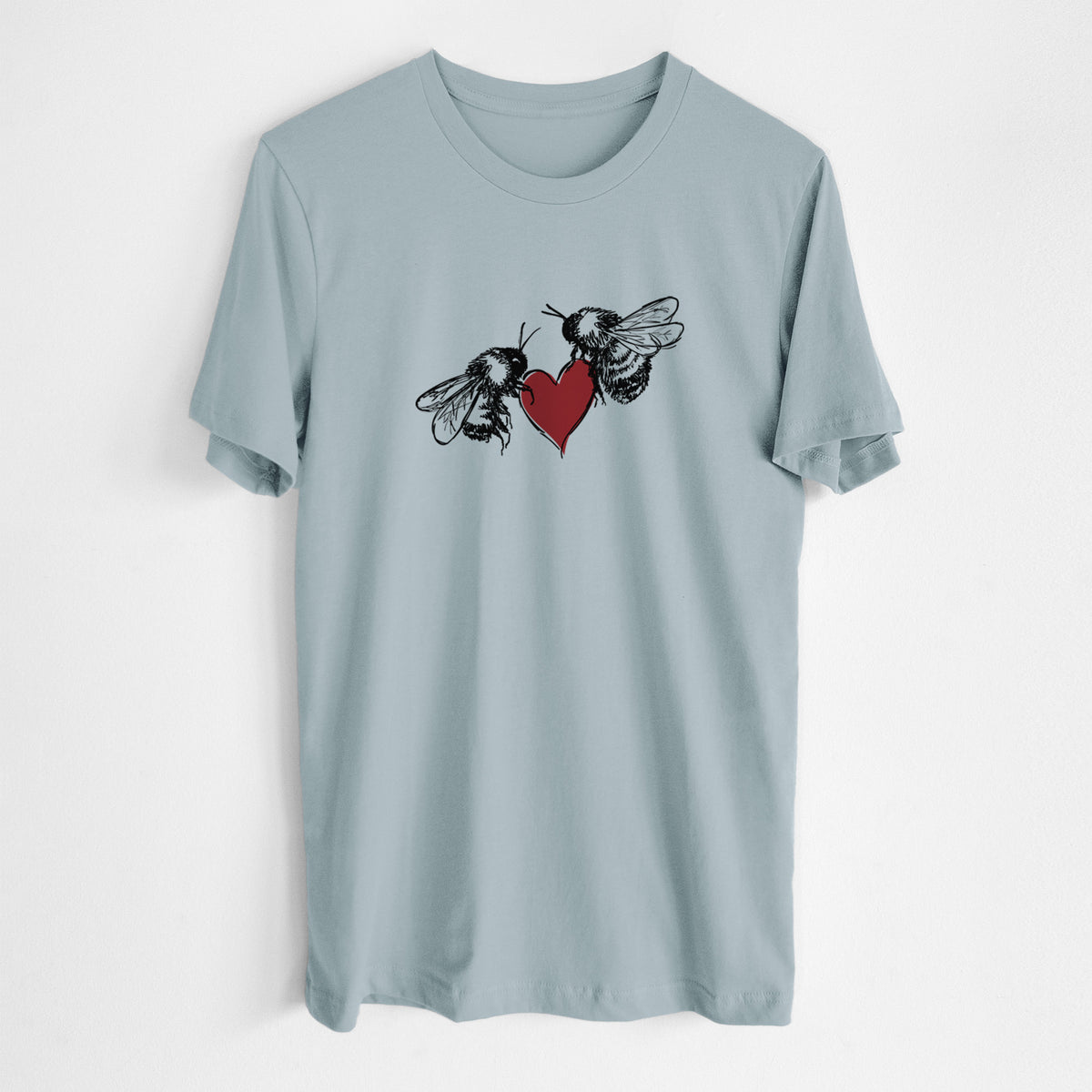 Vintage denim lightweight cotton t-shirt laid flat, printed with a black ink illustration of two bees facing each other with a red heart between them.