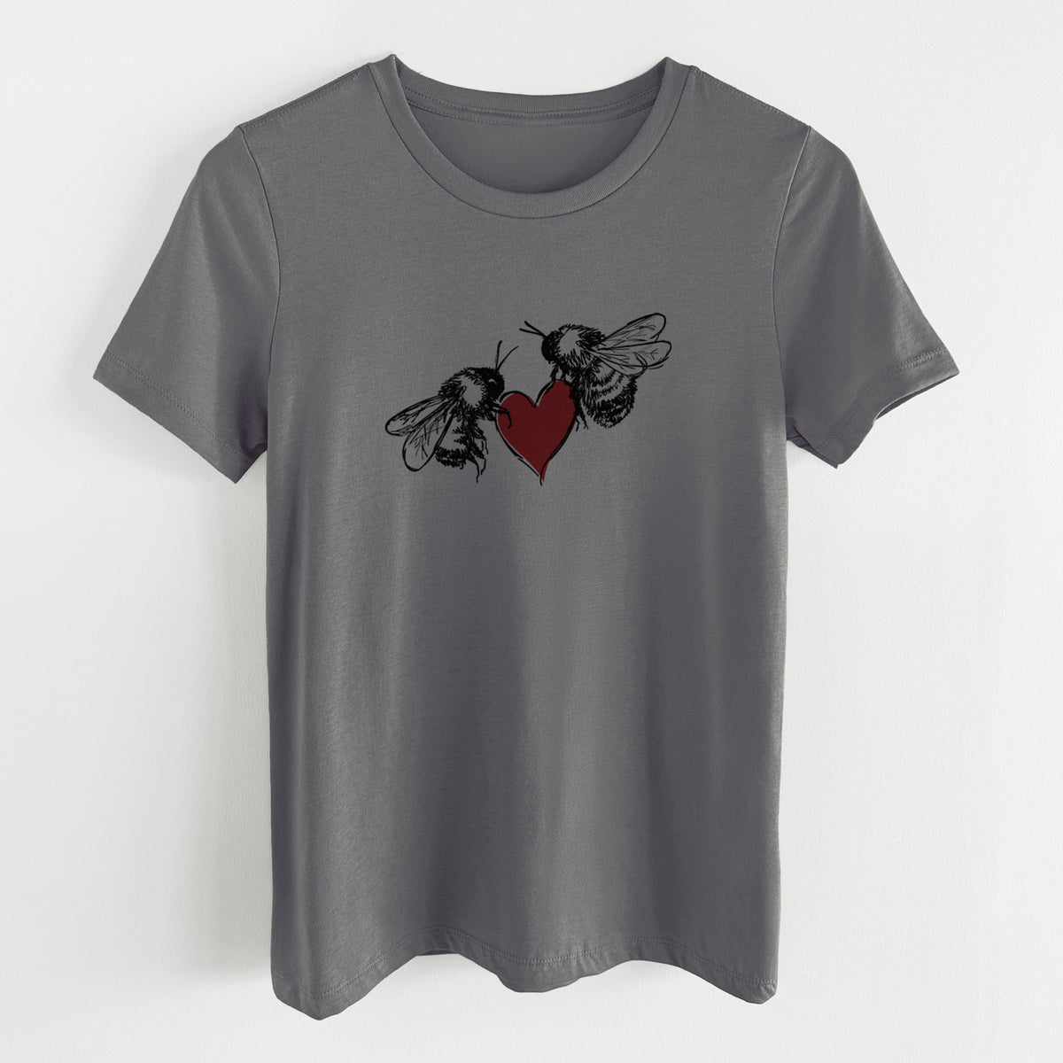 Asphalt women's relaxed fit cotton t-shirt laid flat, printed with a black ink illustration of two bees facing each other with a red heart between them.