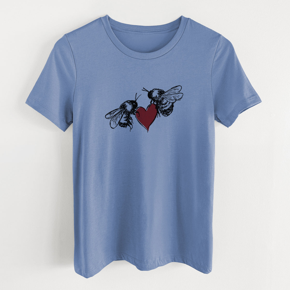 Blue bell women's relaxed fit cotton t-shirt laid flat, printed with a black ink illustration of two bees facing each other with a red heart between them.