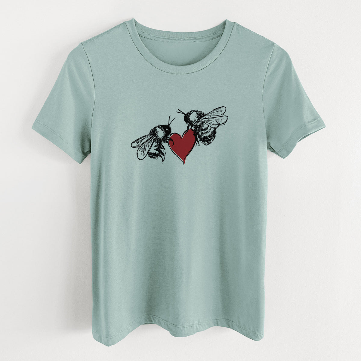 Dusty blue women's relaxed fit cotton t-shirt laid flat, printed with a black ink illustration of two bees facing each other with a red heart between them.