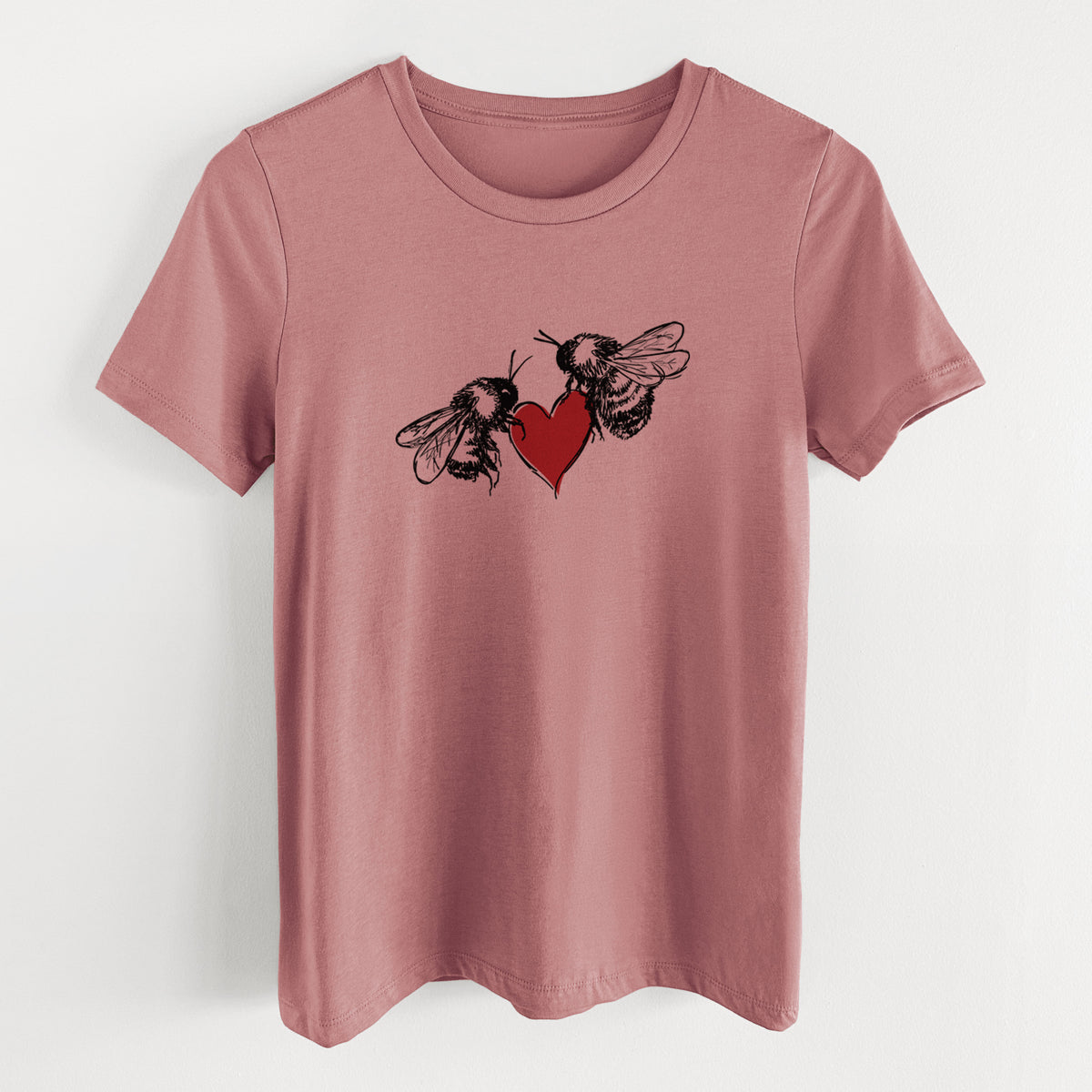 Mauve pink women's relaxed fit cotton t-shirt laid flat, printed with a black ink illustration of two bees facing each other with a red heart between them.