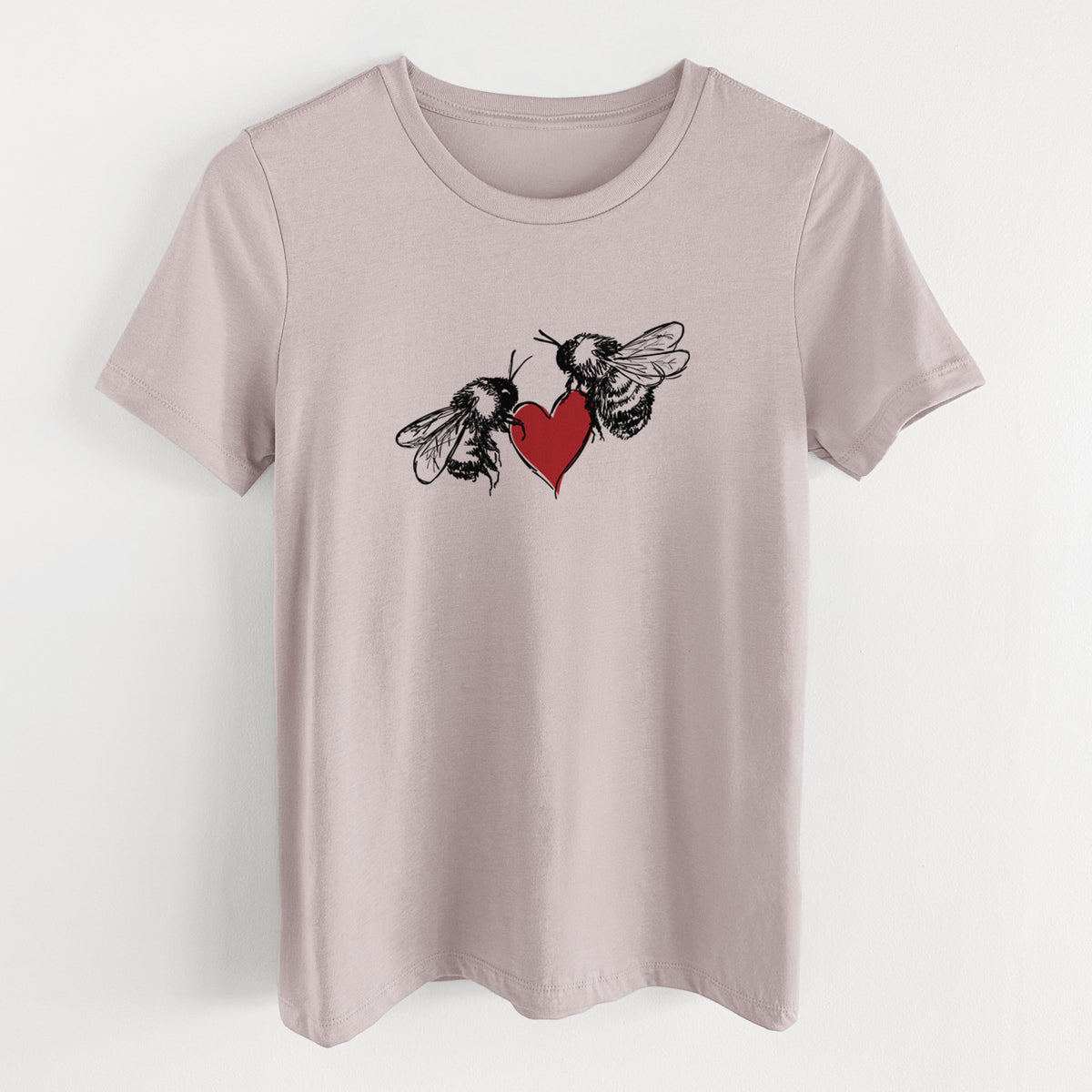 Pink gravel women's relaxed fit cotton t-shirt laid flat, printed with a black ink illustration of two bees facing each other with a red heart between them.