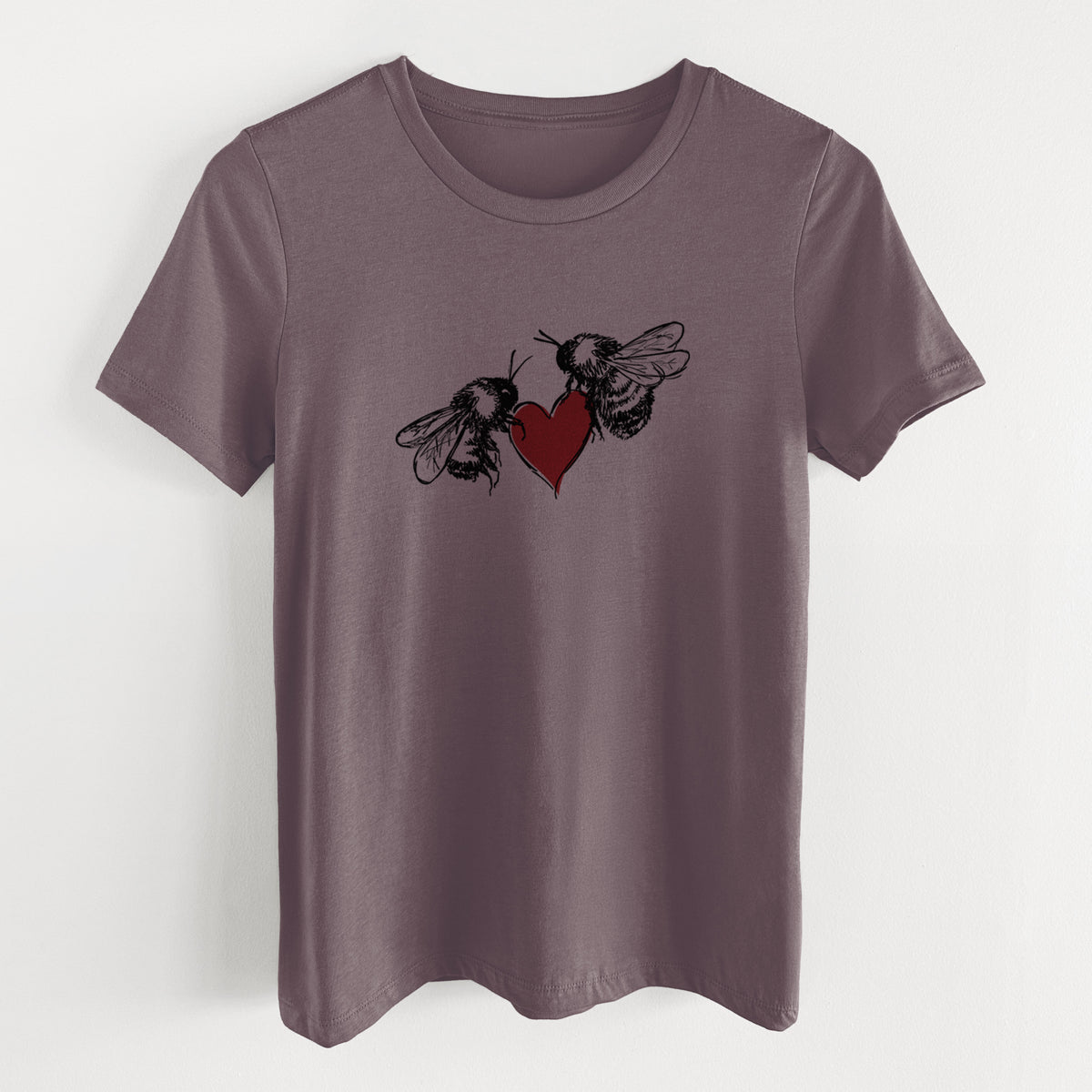 Purple storm women's relaxed fit cotton t-shirt laid flat, printed with a black ink illustration of two bees facing each other with a red heart between them.