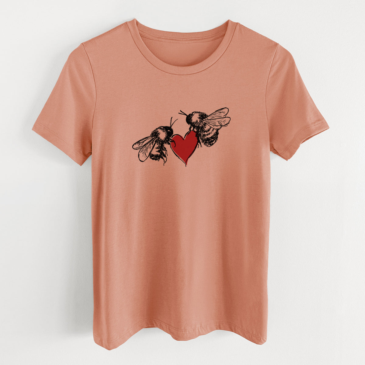 Terracotta orange women's relaxed fit cotton t-shirt laid flat, printed with a black ink illustration of two bees facing each other with a red heart between them.