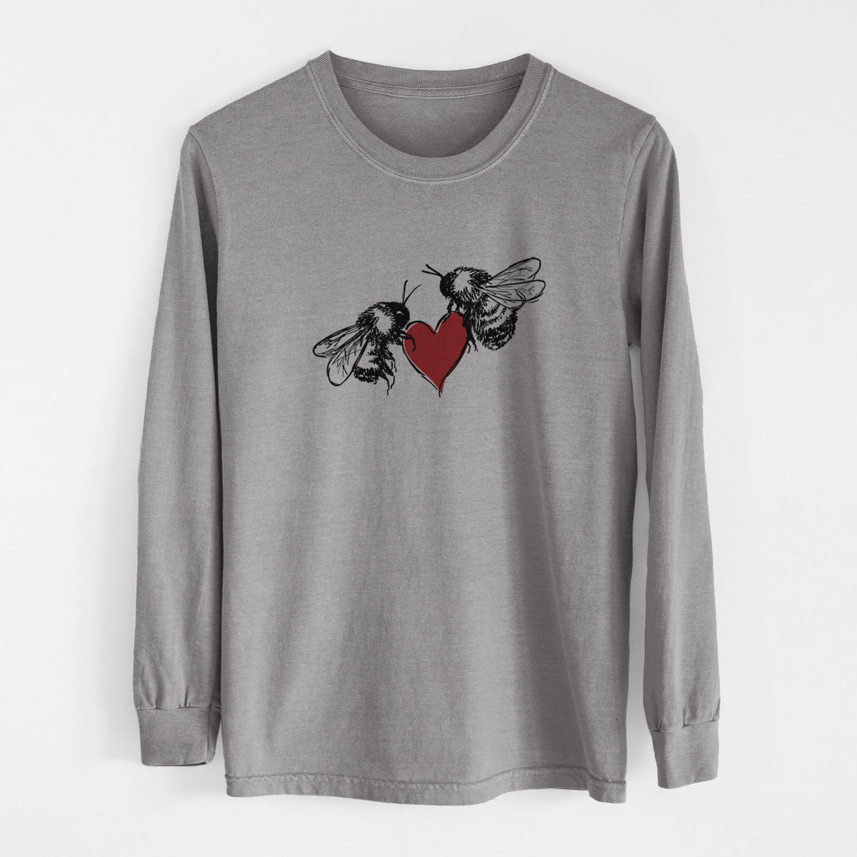 Grey Comfort Colors long sleeve shirt laid flat, printed with a black ink illustration of two bees facing each other with a red heart between them.