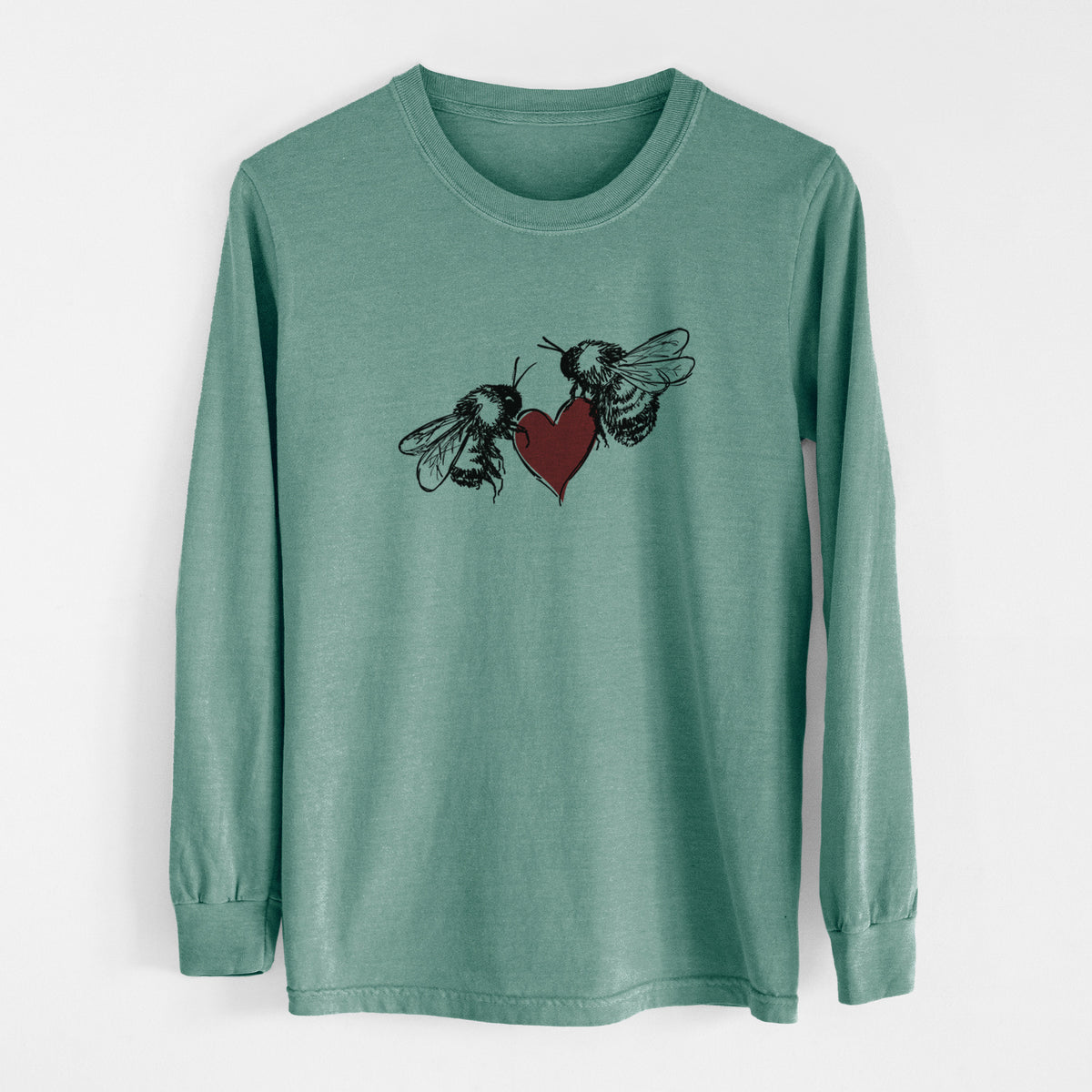 Pine green Comfort Colors long sleeve shirt laid flat, printed with a black ink illustration of two bees facing each other with a red heart between them.