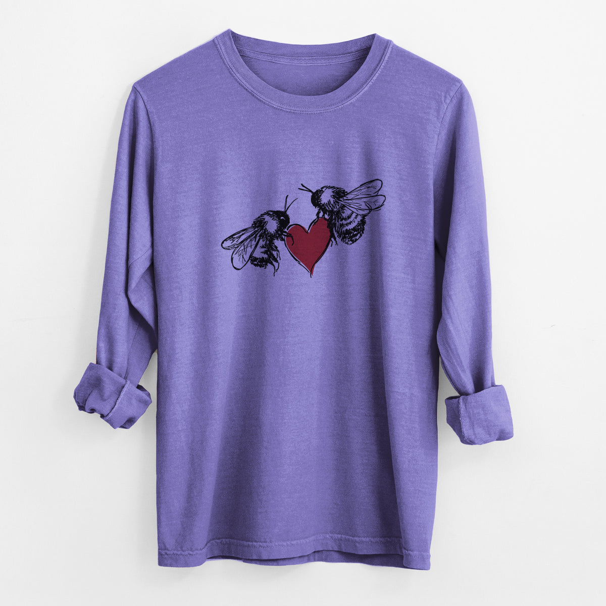 Violet purple Comfort Colors long sleeve shirt laid flat with the cuffs rolled, printed with a black ink illustration of two bees facing each other with a red heart between them.