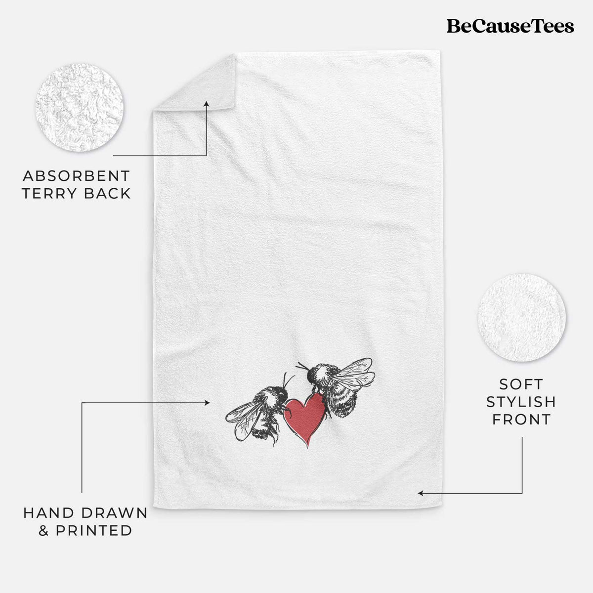 White hand towel printed with a black ink illustration of two bees facing each other with a red heart between them.