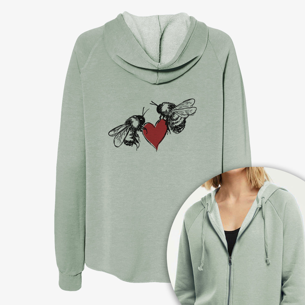Women's Cali Wave zip-up sweatshirt printed with a black ink illustration of two bees facing each other with a red heart between them, with a close-up of the zipper.