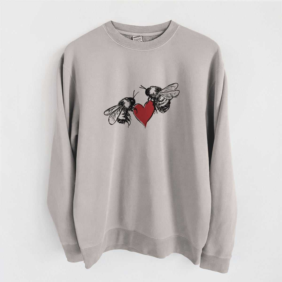 Cement grey pigment dyed crewneck sweatshirt laid flat, printed with a black ink illustration of two bees facing each other with a red heart between them.