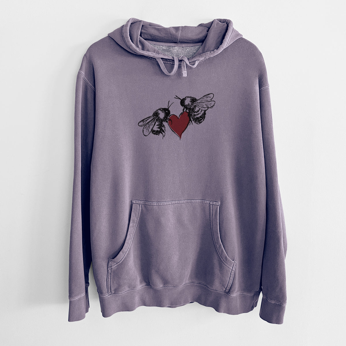 Plum purple pigment dyed hoodie laid flat, printed with a black ink illustration of two bees facing each other with a red heart between them.