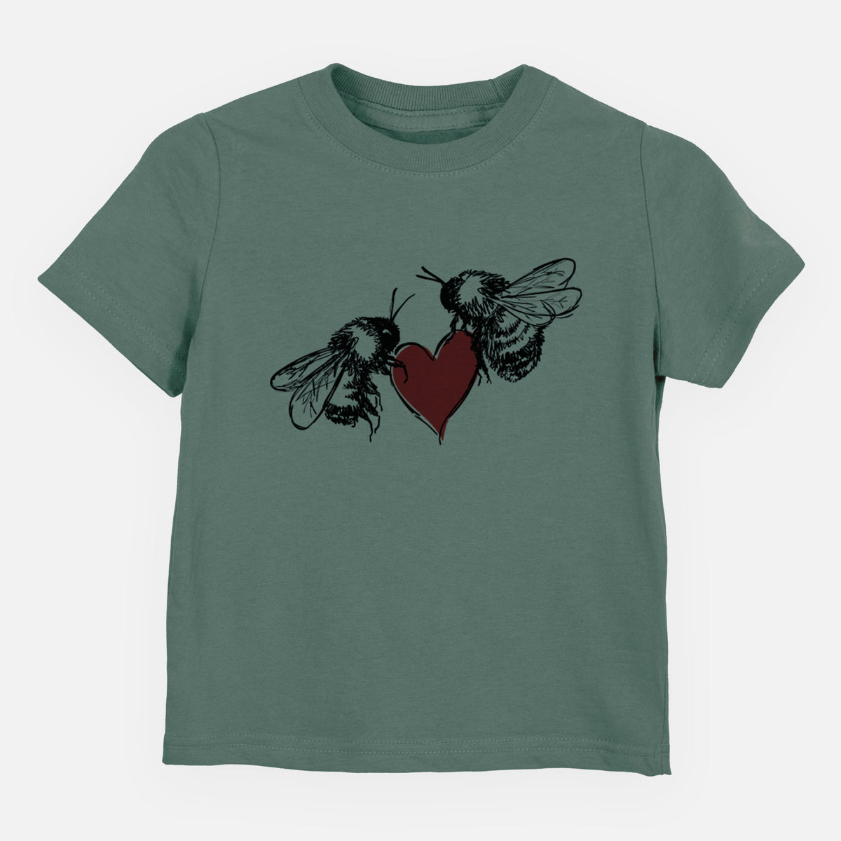 Basil green toddler t-shirt laid flat, printed with a black ink illustration of two bees facing each other with a red heart between them.