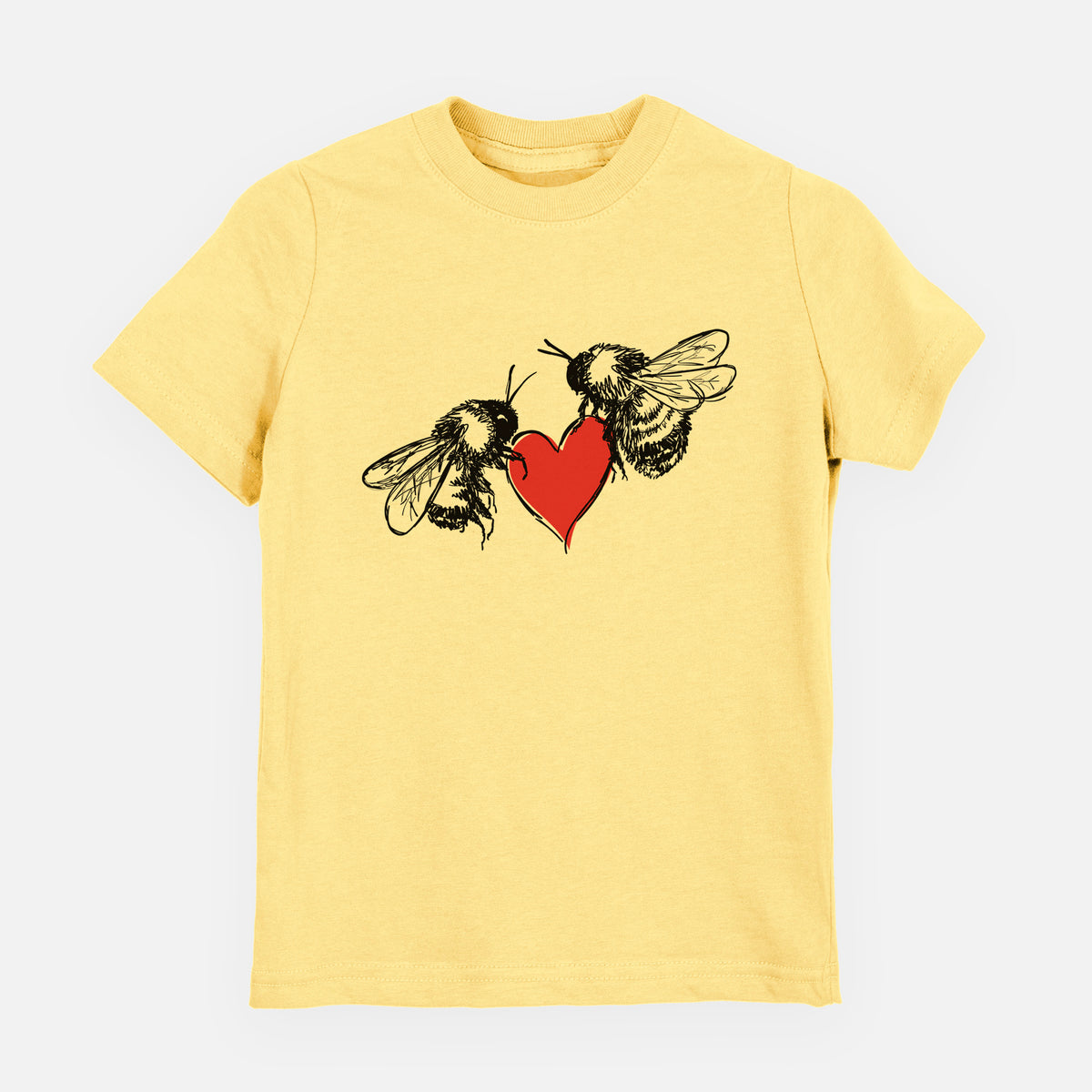 Butter yellow youth t-shirt laid flat, printed with a black ink illustration of two bees facing each other with a red heart between them.