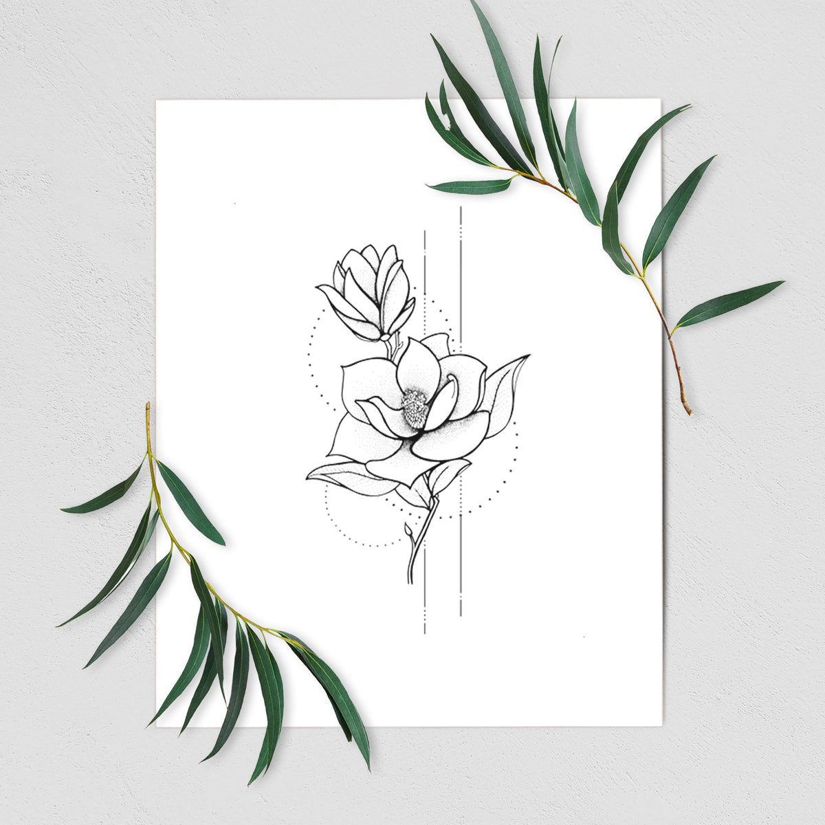 Art print of a black ink line drawing of a magnolia blossom on a stem, shown with eucalyptus leaves.