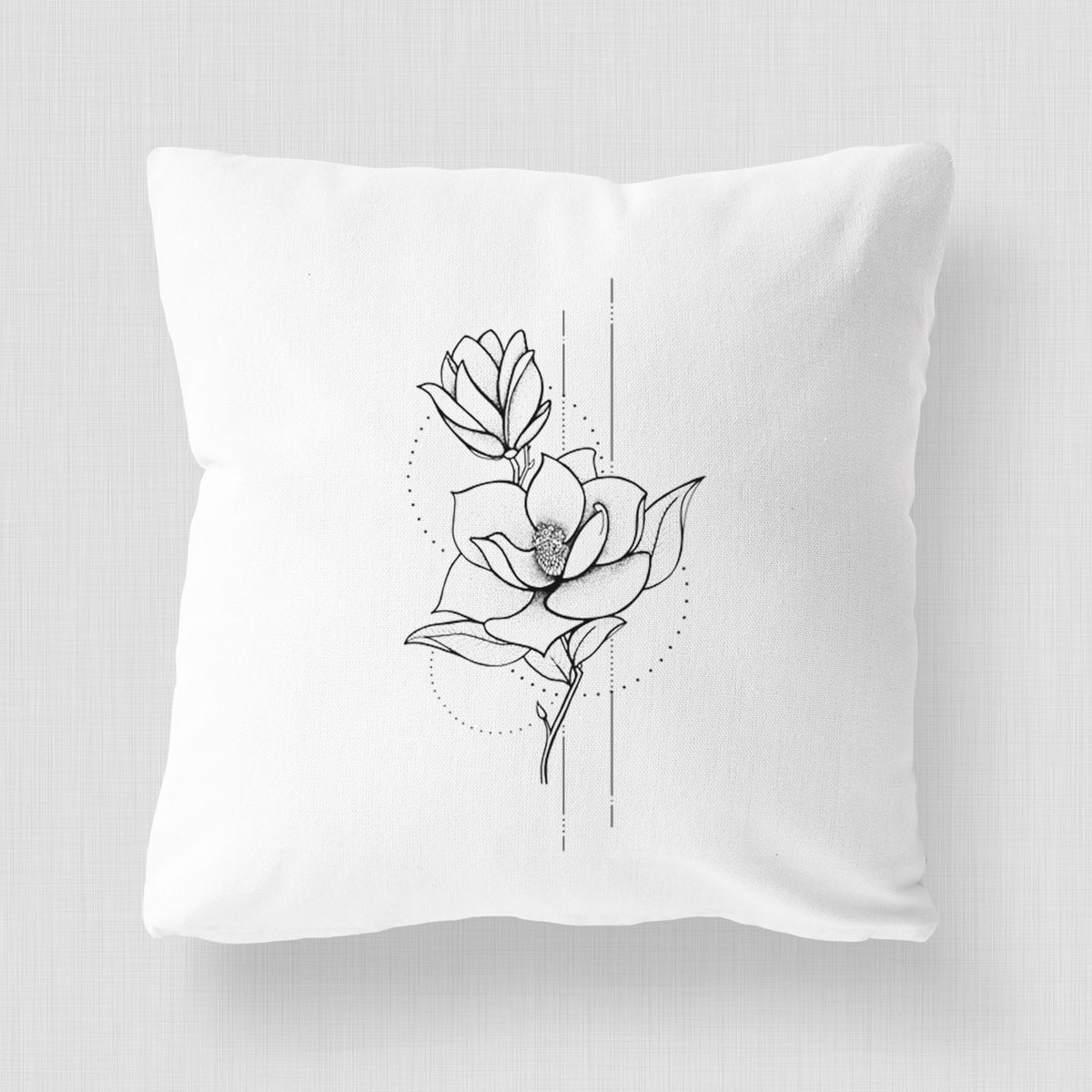 White pillow cover printed with a black ink line drawing of a magnolia blossom on a stem.