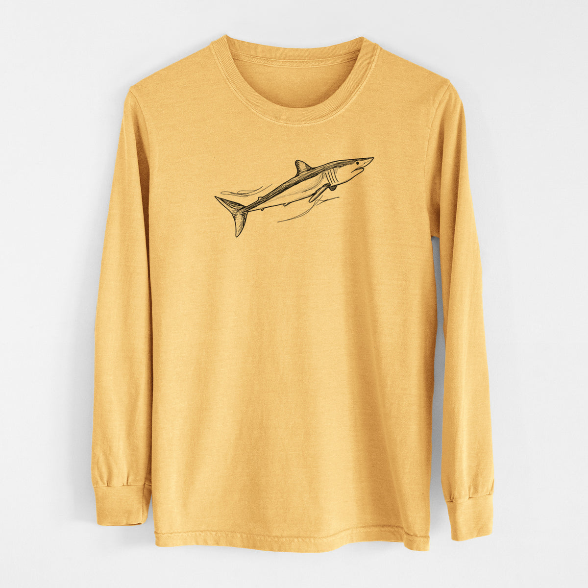 Golden wheat yellow Comfort Colors long sleeve shirt laid flat, printed with a black ink illustration of a mako shark swimming.