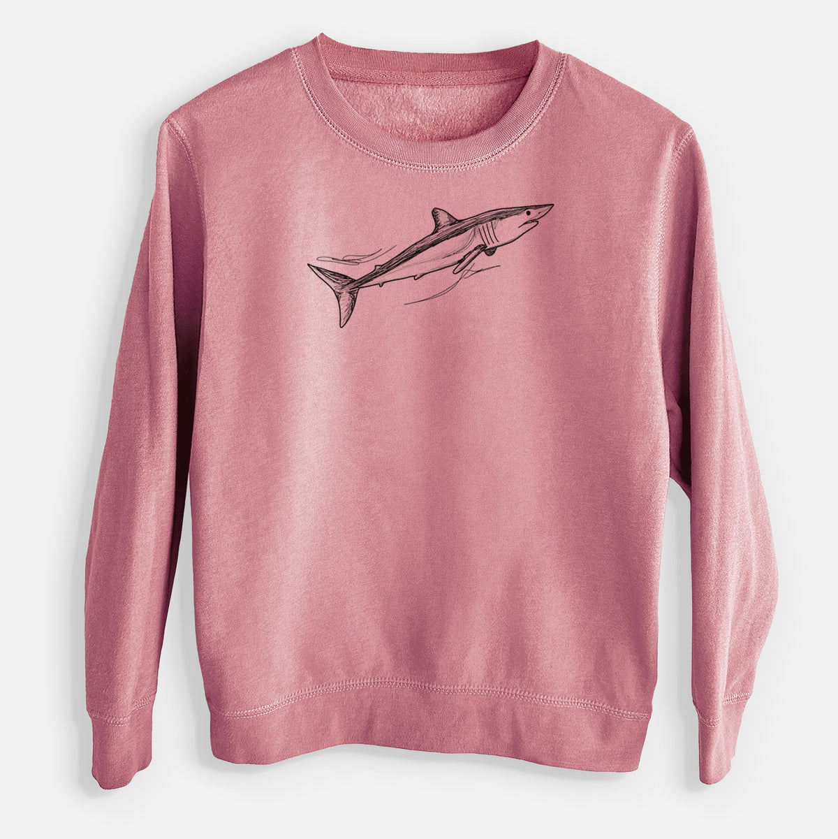 Mauve pink youth crewneck sweatshirt laid flat, printed with a black ink illustration of a mako shark swimming.