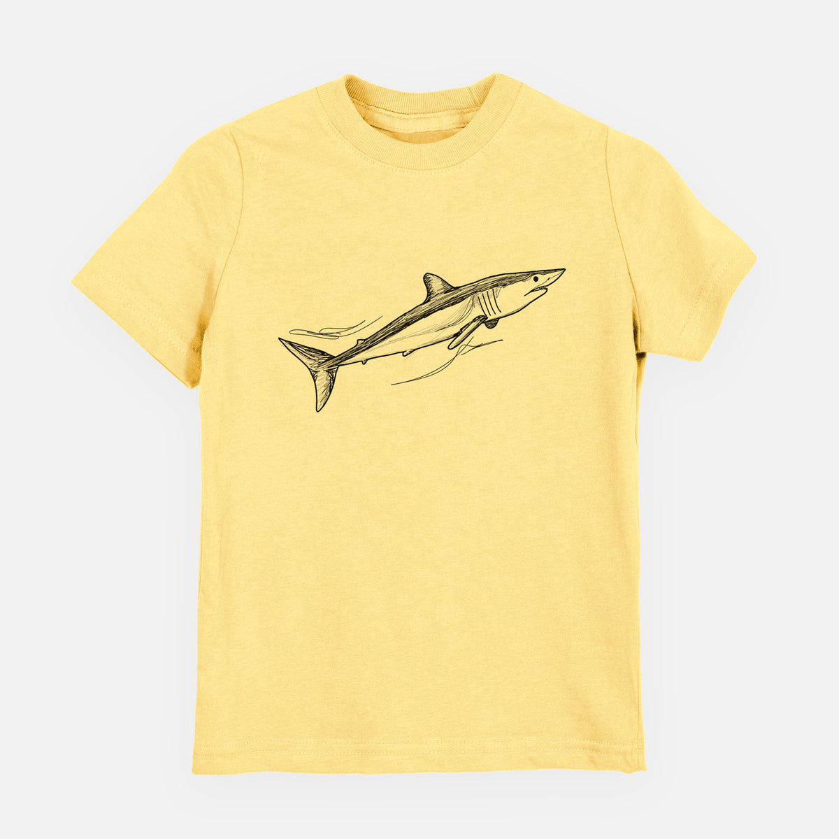 Butter yellow youth t-shirt laid flat, printed with a black ink illustration of a mako shark swimming.