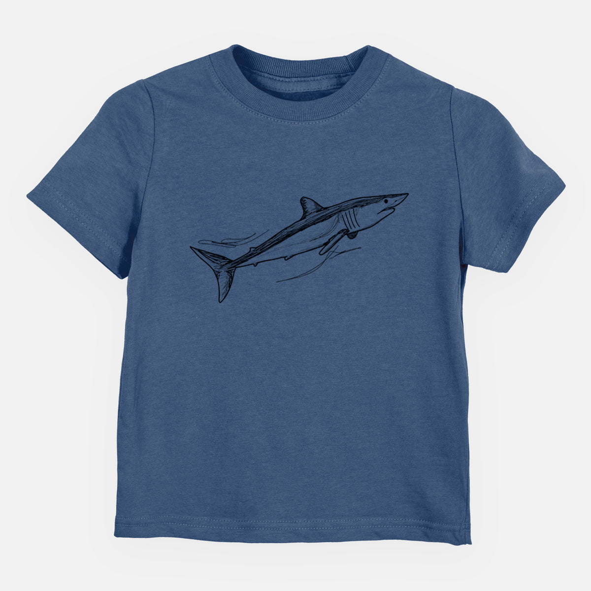Indigo blue toddler t-shirt laid flat, printed with a black ink illustration of a mako shark swimming.