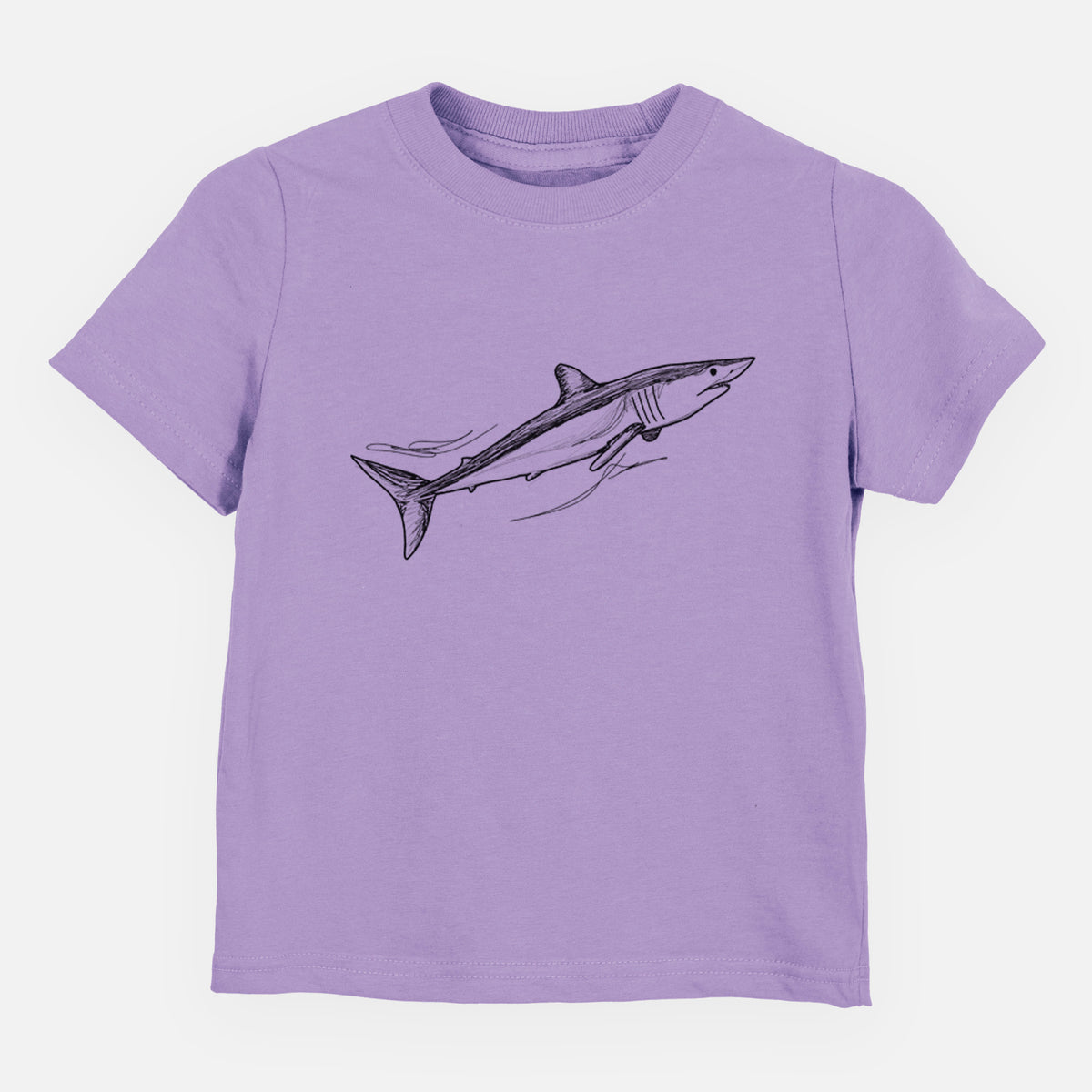 Lavender toddler t-shirt laid flat, printed with a black ink illustration of a mako shark swimming.