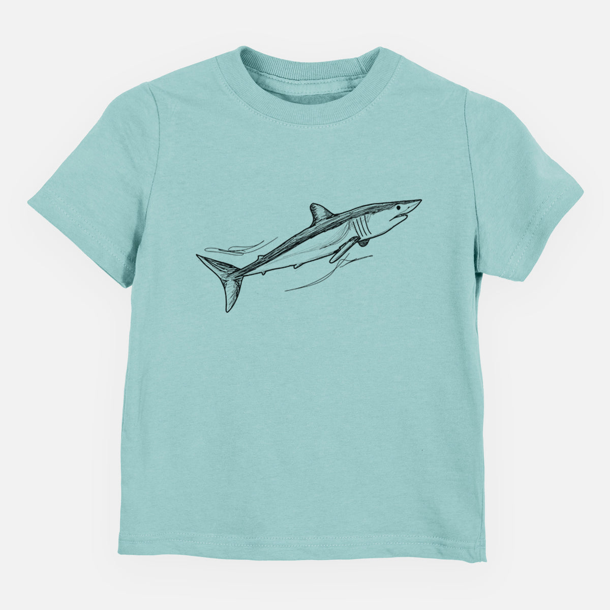 Saltwater toddler t-shirt laid flat, printed with a black ink illustration of a mako shark swimming.