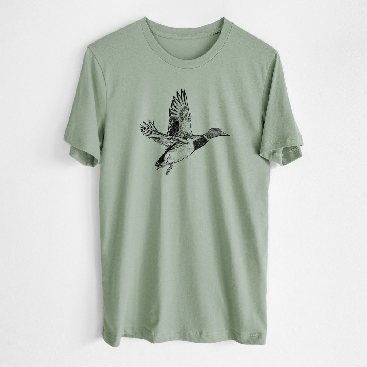 Sage green lightweight cotton t-shirt laid flat, printed with a detailed black ink illustration of a male mallard duck taking flight.