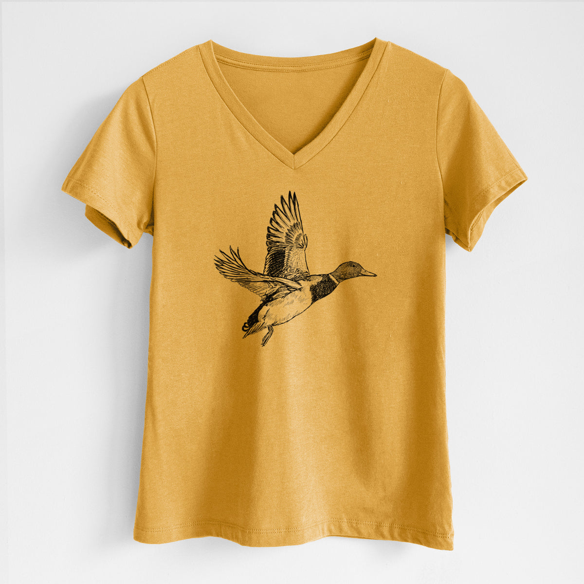 Honeycomb yellow women's relaxed fit cotton V-neck t-shirt laid flat, printed with a detailed black ink illustration of a male mallard duck taking flight.