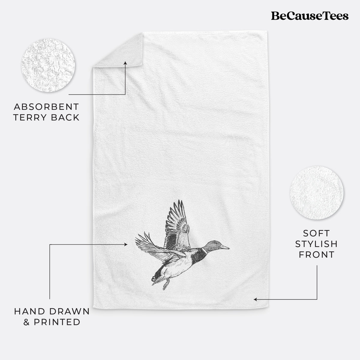 White hand towel printed with a detailed black ink illustration of a male mallard duck taking flight.