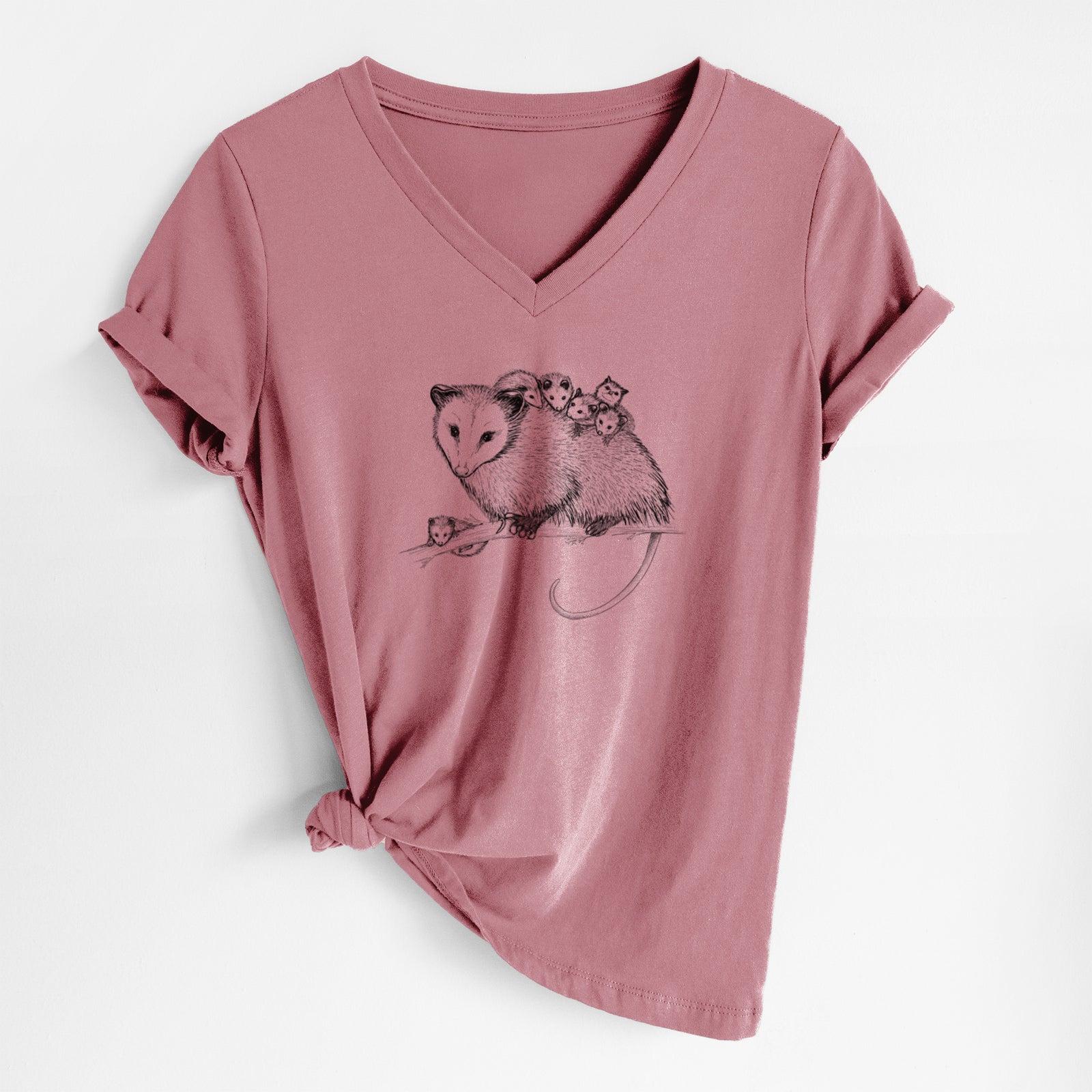 Mauve pink women's relaxed fit cotton V-neck t-shirt laid flat, printed with a black ink illustration of a mother opossum on a branch carrying her babies on her back.