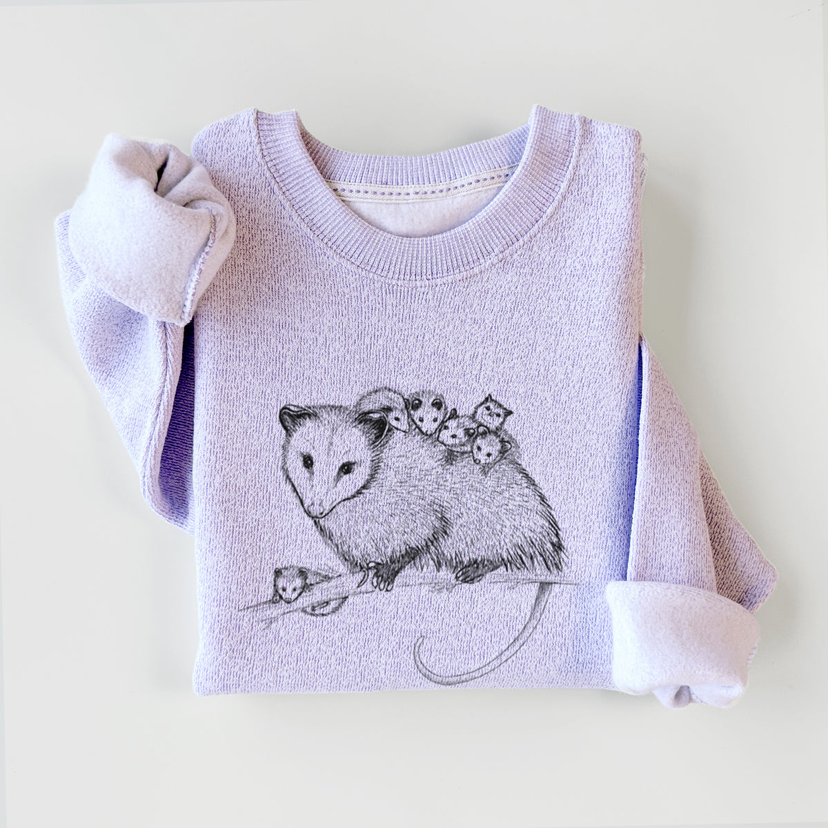 Ice purple knit sweatshirt printed with a black ink illustration of a mother opossum on a branch carrying her babies on her back, styled flat.