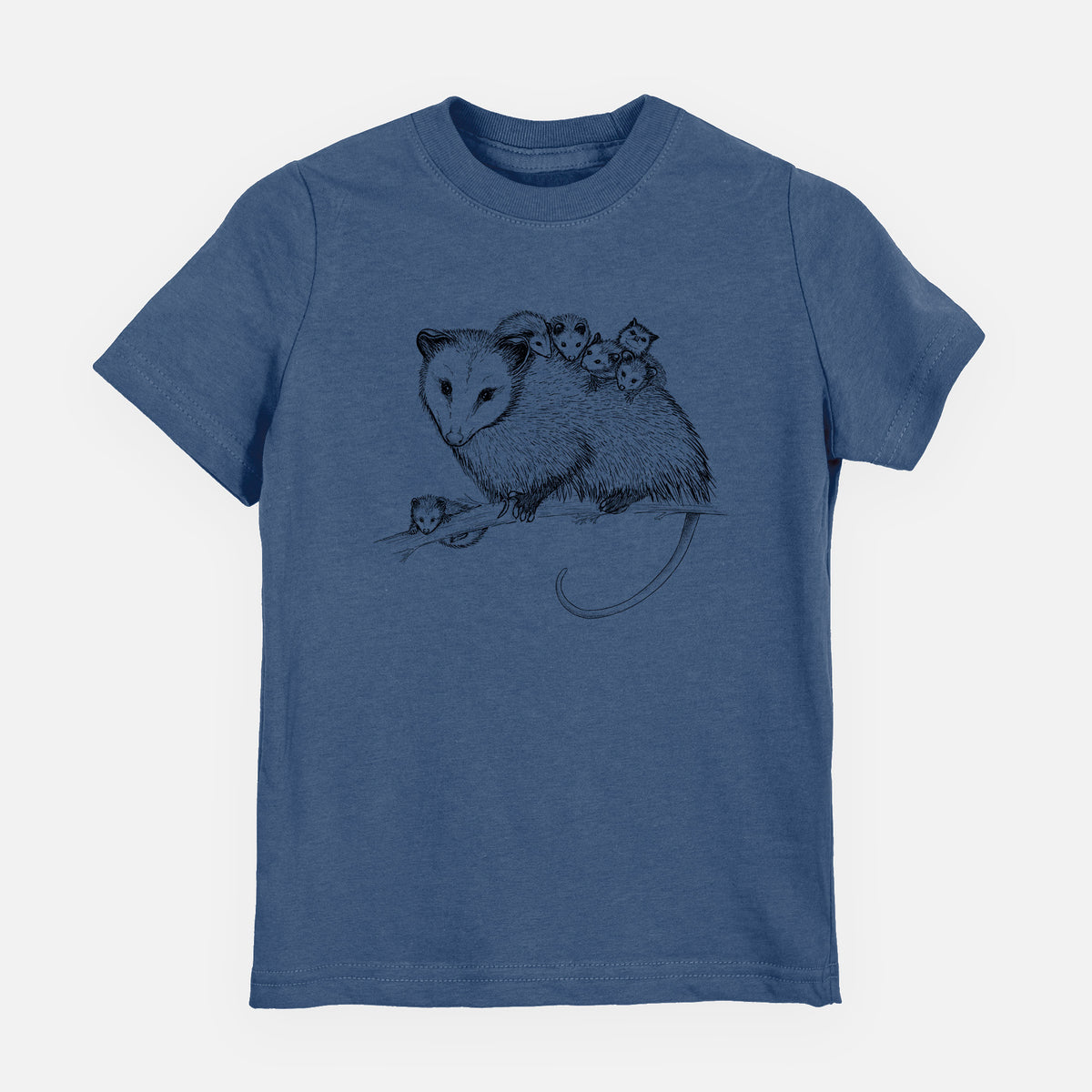 Indigo blue youth t-shirt laid flat, printed with a black ink illustration of a mother opossum on a branch carrying her babies on her back.
