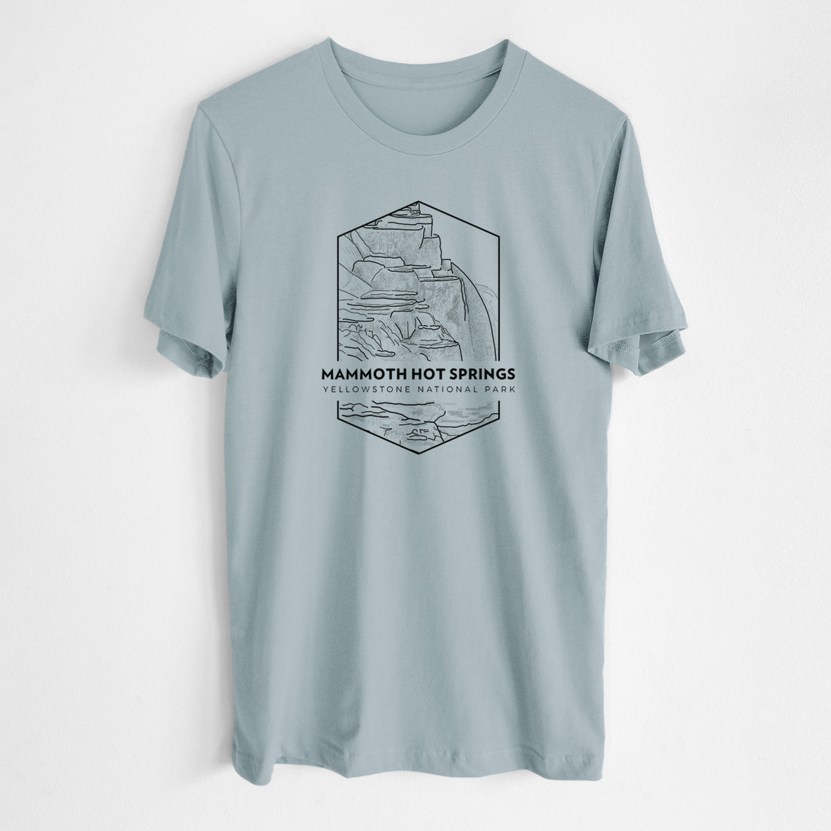 Vintage denim lightweight cotton t-shirt laid flat, printed with a black line art badge of the terraces at Mammoth Hot Springs, with the words Mammoth Hot Springs, Yellowstone National Park.