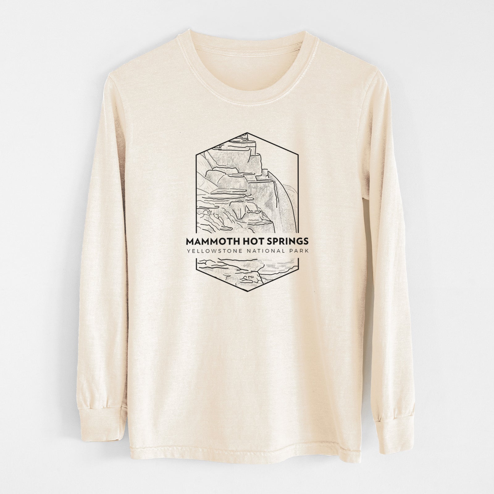 Ivory Comfort Colors long sleeve shirt laid flat, printed with a black line art badge of the terraces at Mammoth Hot Springs, with the words Mammoth Hot Springs, Yellowstone National Park.