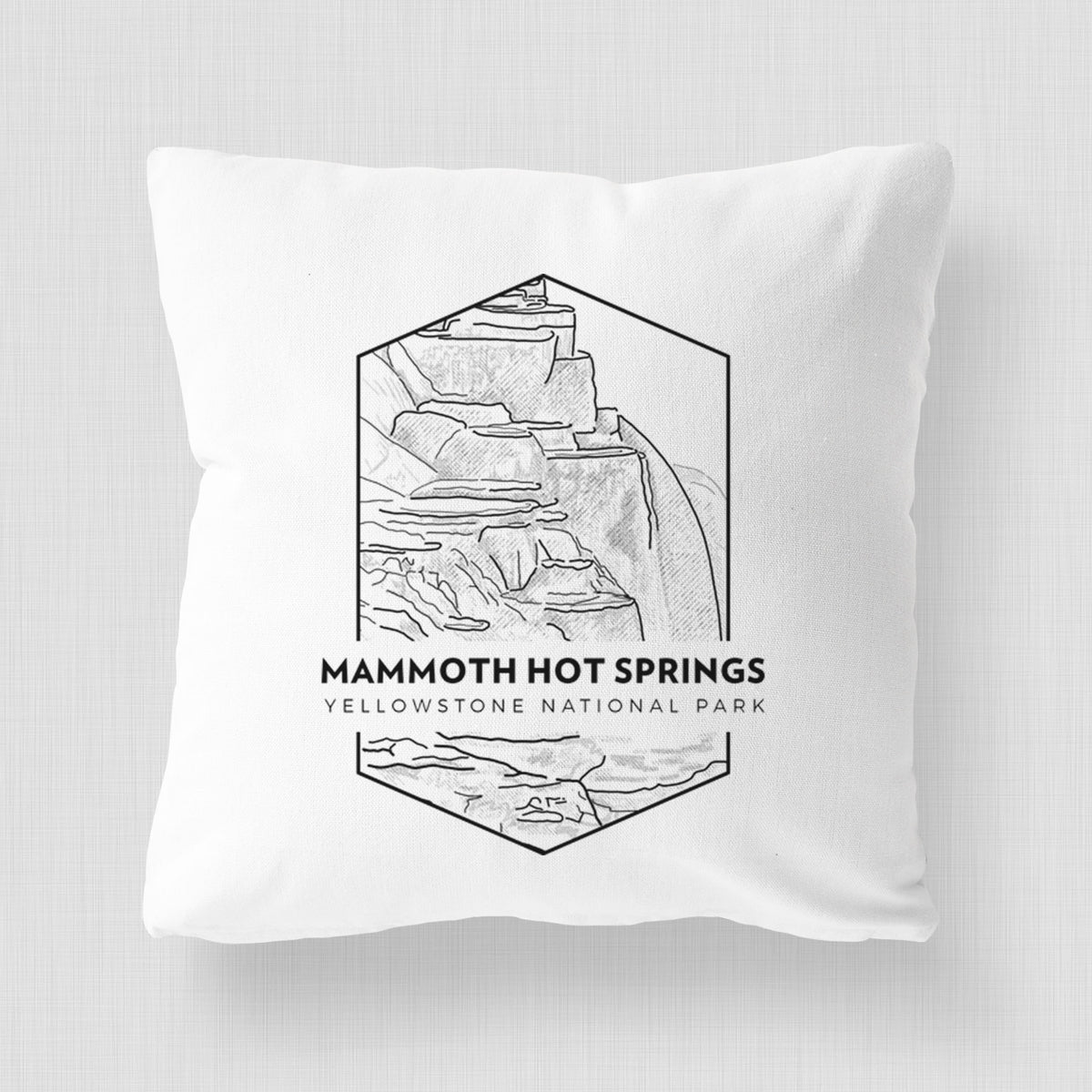 White pillow cover printed with a black line art badge of the terraces at Mammoth Hot Springs, with the words Mammoth Hot Springs, Yellowstone National Park.