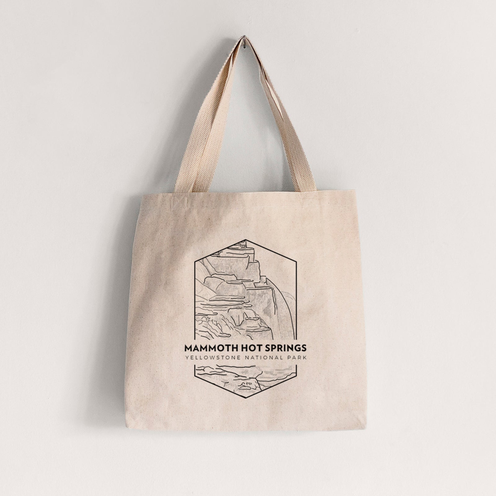 Natural canvas tote bag printed with a black line art badge of the terraces at Mammoth Hot Springs, with the words Mammoth Hot Springs, Yellowstone National Park.